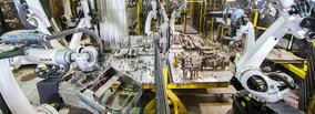 25 KUKA robots assemble crankcase core packages fully automatically at NEUE HALBERG-GUSS