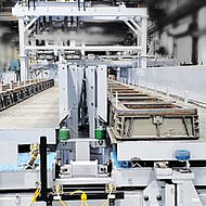 Choosing between fluid power or electrical actuation within a mold handling system