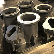 GE Aviation and GE Additive engineers have switched four existing parts from castings to metal 3D printing—and see potential for hundreds more