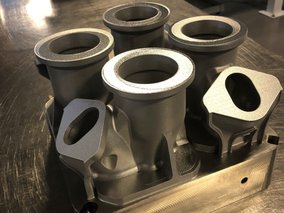 GE Aviation and GE Additive engineers have switched four existing parts from castings to metal 3D printing—and see potential for hundreds more